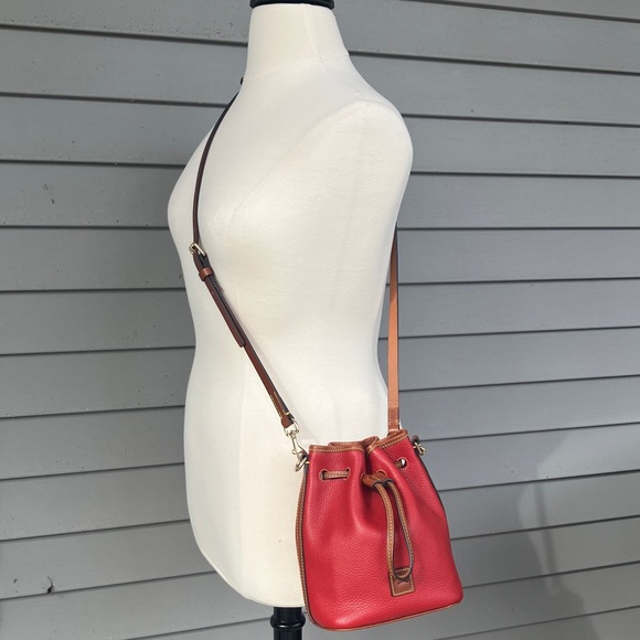 Dooney & Bourke red pebble grain leather small drawstring crossbody purse. - Picture 2 of 5